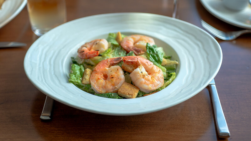 Salad topped with shrimp